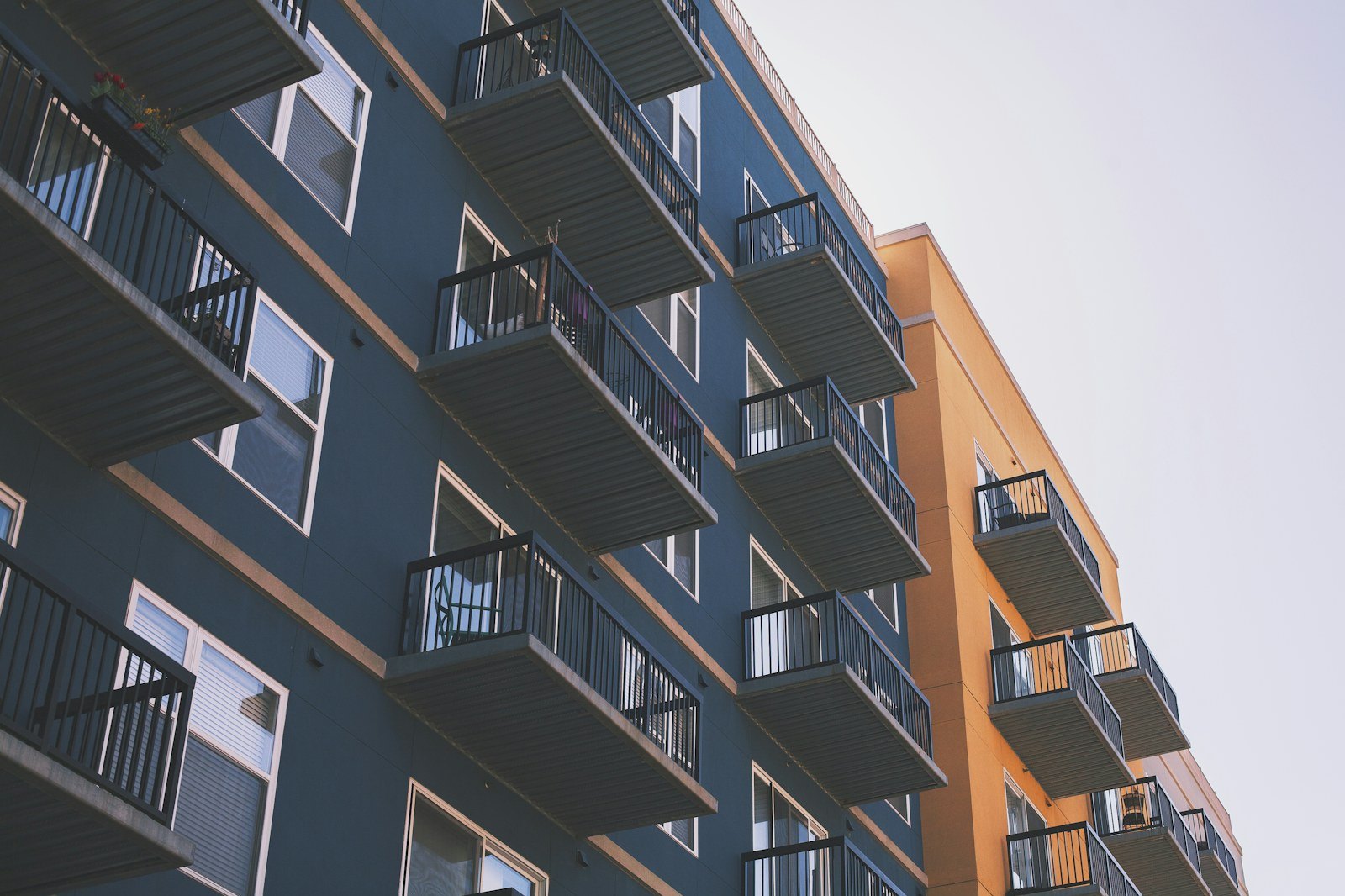 Balcony elevation of a multi-storey residential income building seen from the street